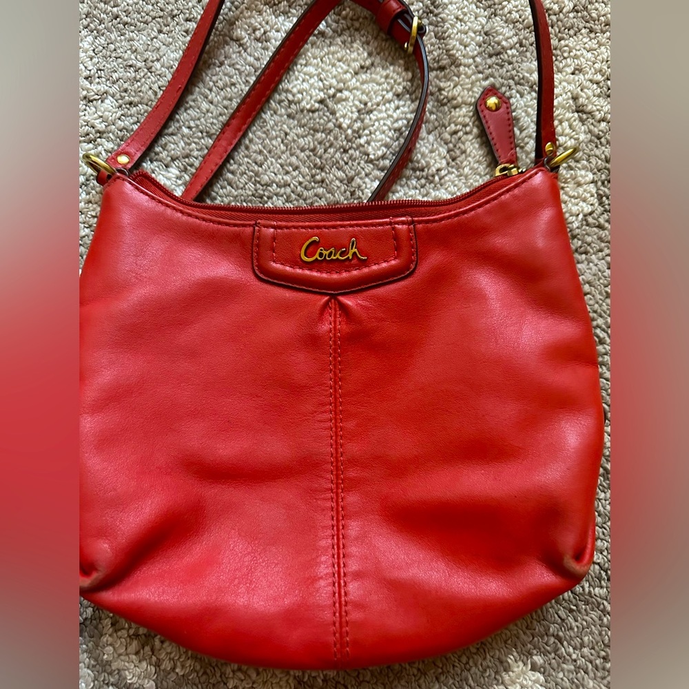 Coach shoulder bag, slightly used. It’s coral and perfect for a date night!